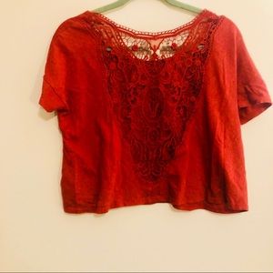 Reddish orange crop top with open back